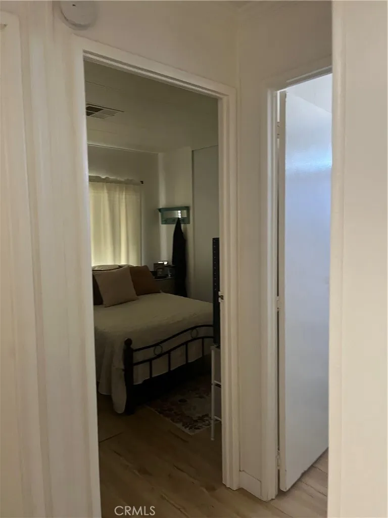 3700 Buchanan Street, Unit 98 Riverside, CA 92503 - Photo 10 of 18 a bedroom with a bed and a mirror