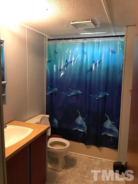 2017 Wiley Road Spring Hope, NC 27882 - Photo 12 of 23 a bathroom with a toilet and a shower