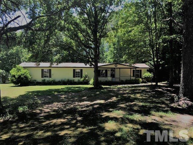 2017 Wiley Road Spring Hope, NC 27882 - Photo 3 of 23 a front view of a house with a garden