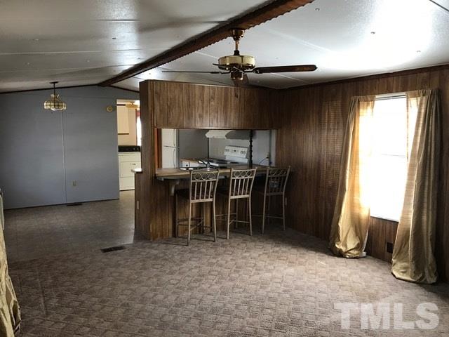 2017 Wiley Road Spring Hope, NC 27882 - Photo 10 of 23 a view of kitchen with furniture and a refrigerator