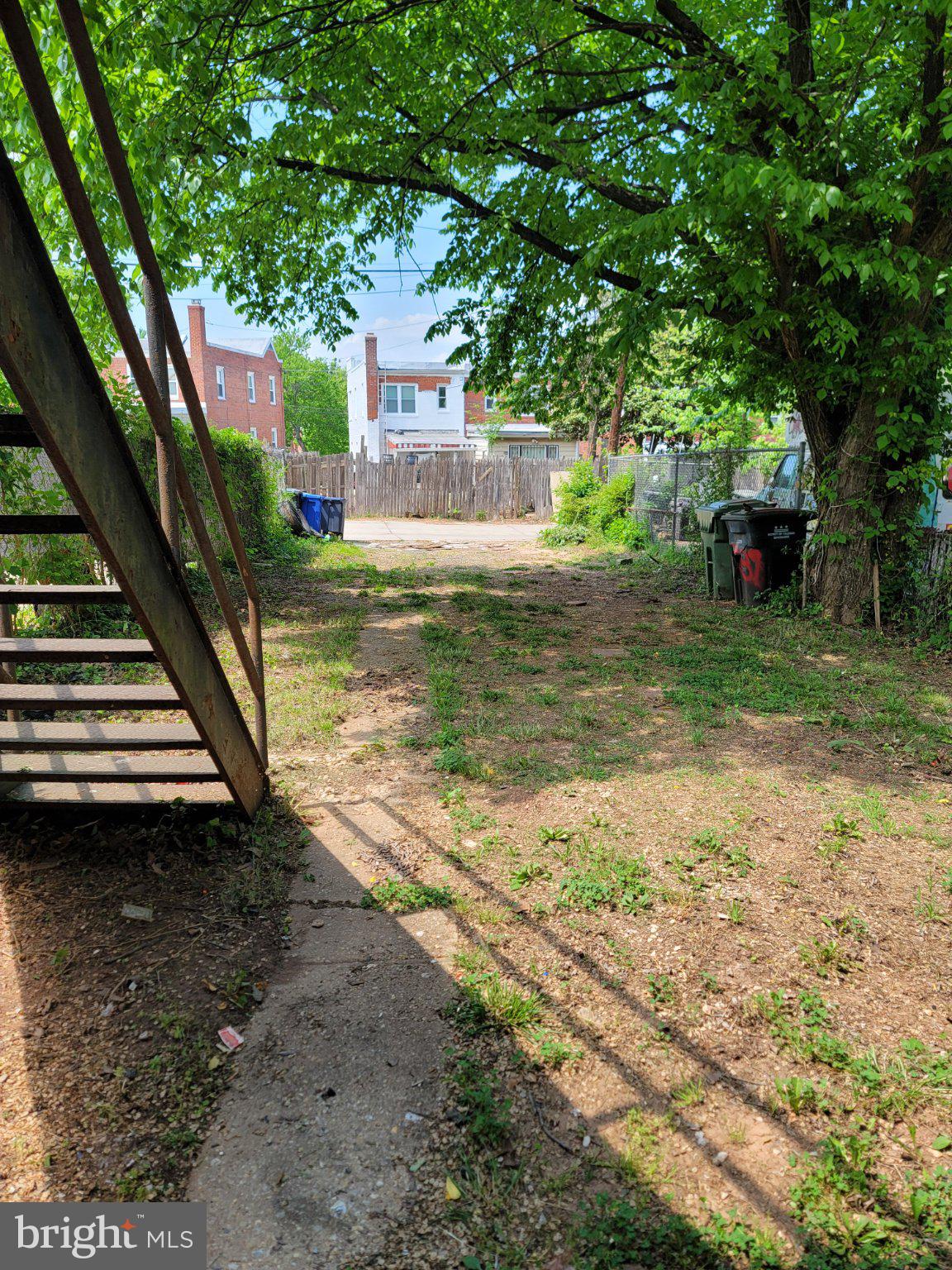 5037 Benning Road Southeast Washington, DC 20019 - Photo 7 of 8 a view of a house with a yard