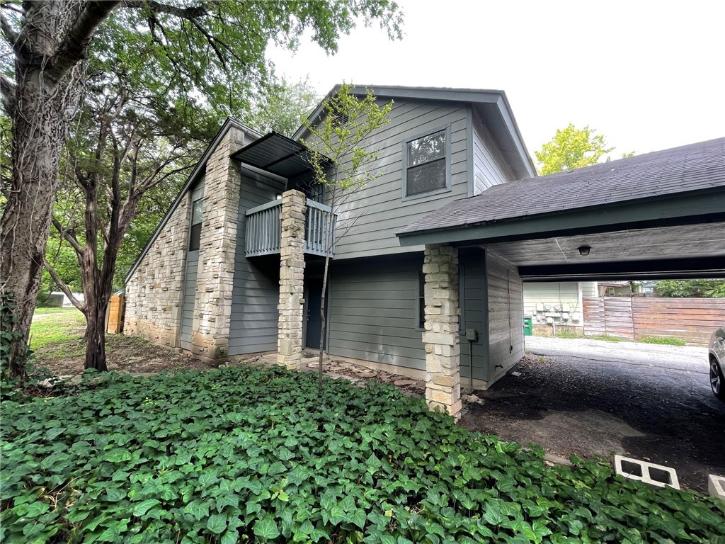 1702 Cinnamon Path, Unit B Austin, TX 78704 - Photo 1 of 1 a front view of a house with yard and garage