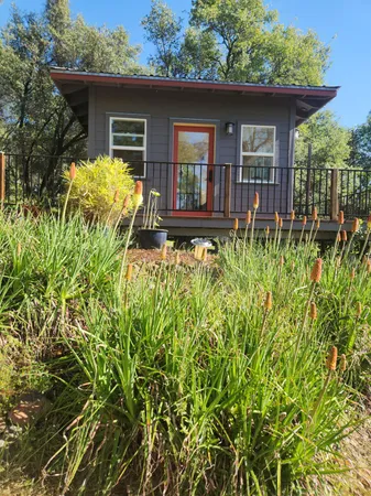 a front view of a house with garden