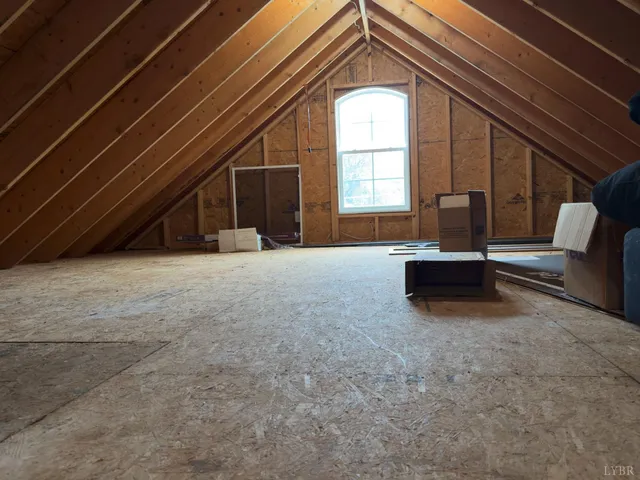 a view of an empty room with a fireplace