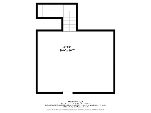 a picture of a bench in front of a wall