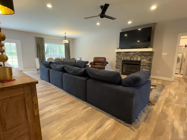 a living room with furniture and a fireplace