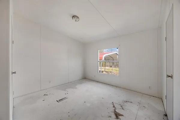 a view of an empty room and window