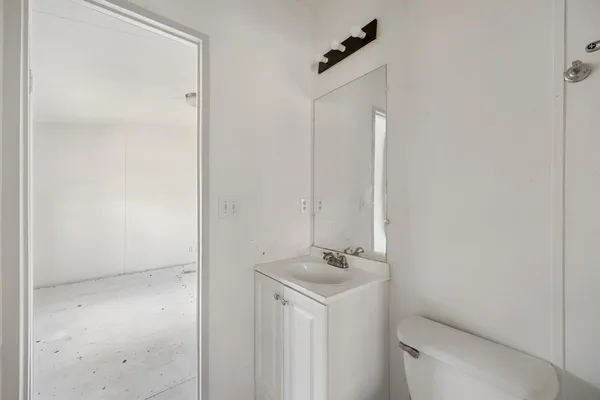 a bathroom with a sink and mirror