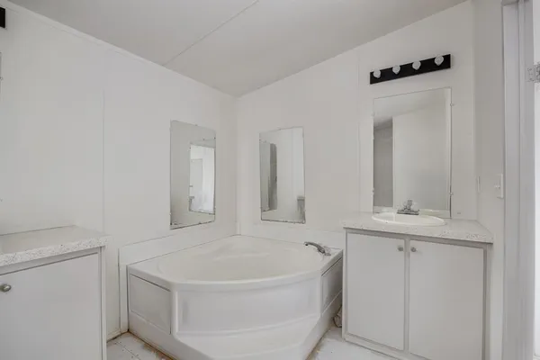 a bathroom with a bathtub and a sink