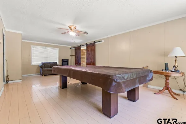 a gaming hall with table tennis pool table and a window