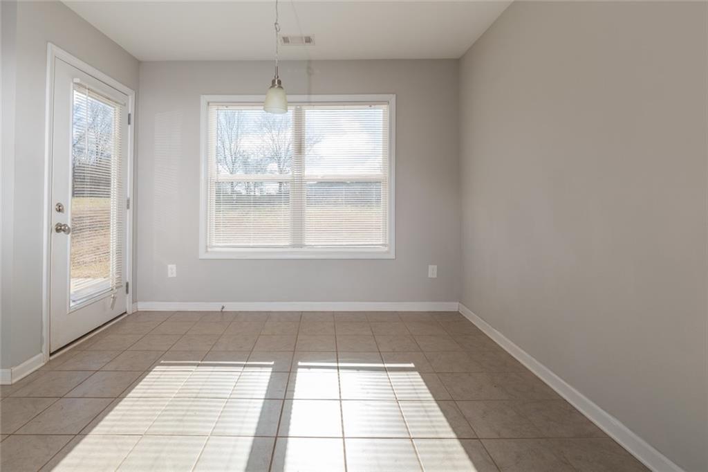 82 Gray Field Court Jefferson, GA 30549 - Photo 8 of 30 a view of an empty room with a window