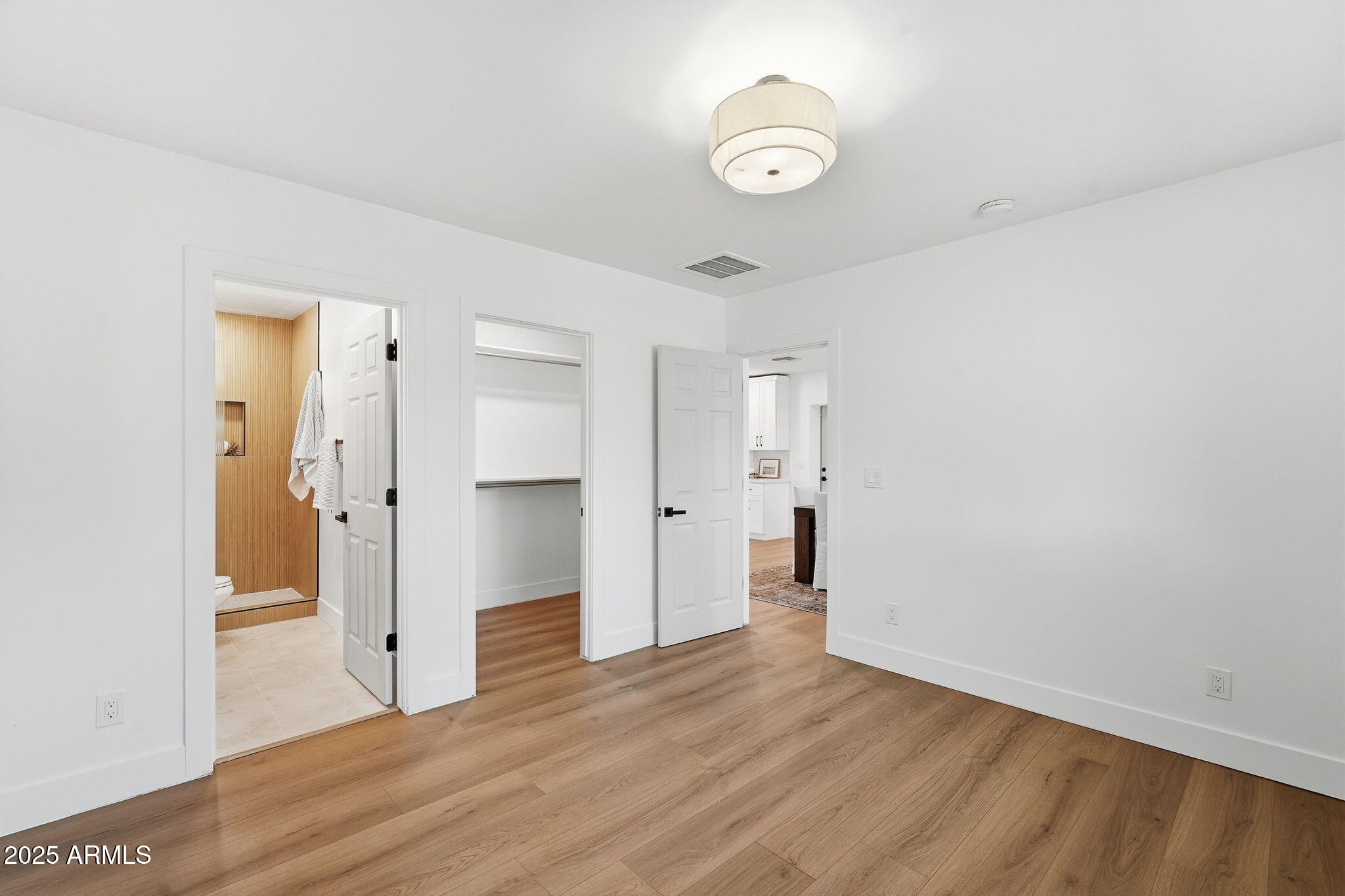 3102 North 34th Street Phoenix, AZ 85018 - Photo 12 of 20 a view of a room with wooden floor