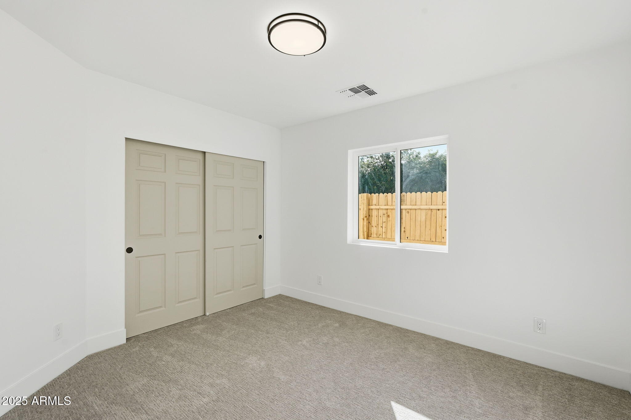 3102 North 34th Street Phoenix, AZ 85018 - Photo 16 of 20 an empty room with windows