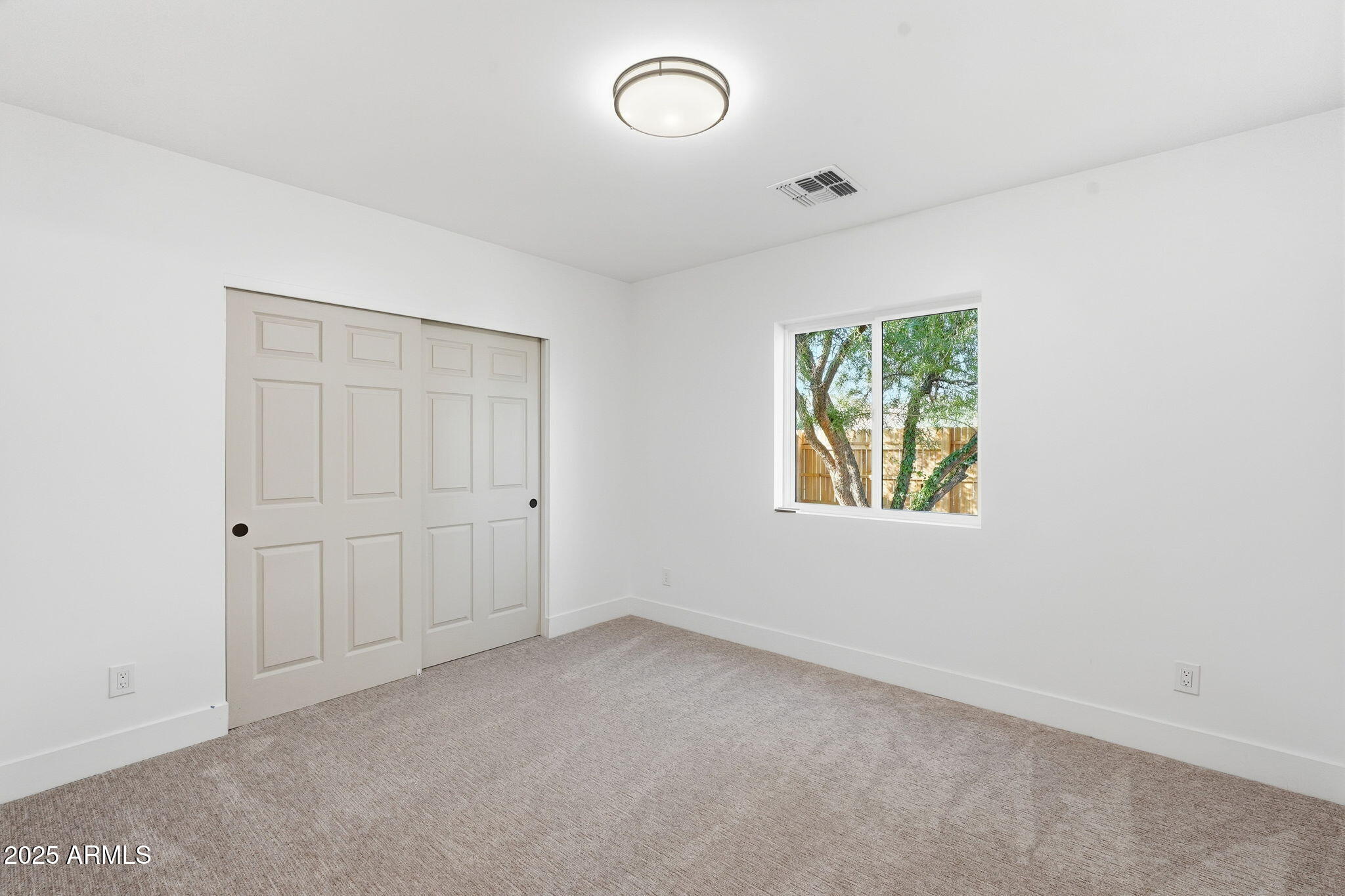 3102 North 34th Street Phoenix, AZ 85018 - Photo 17 of 20 an empty room with a window