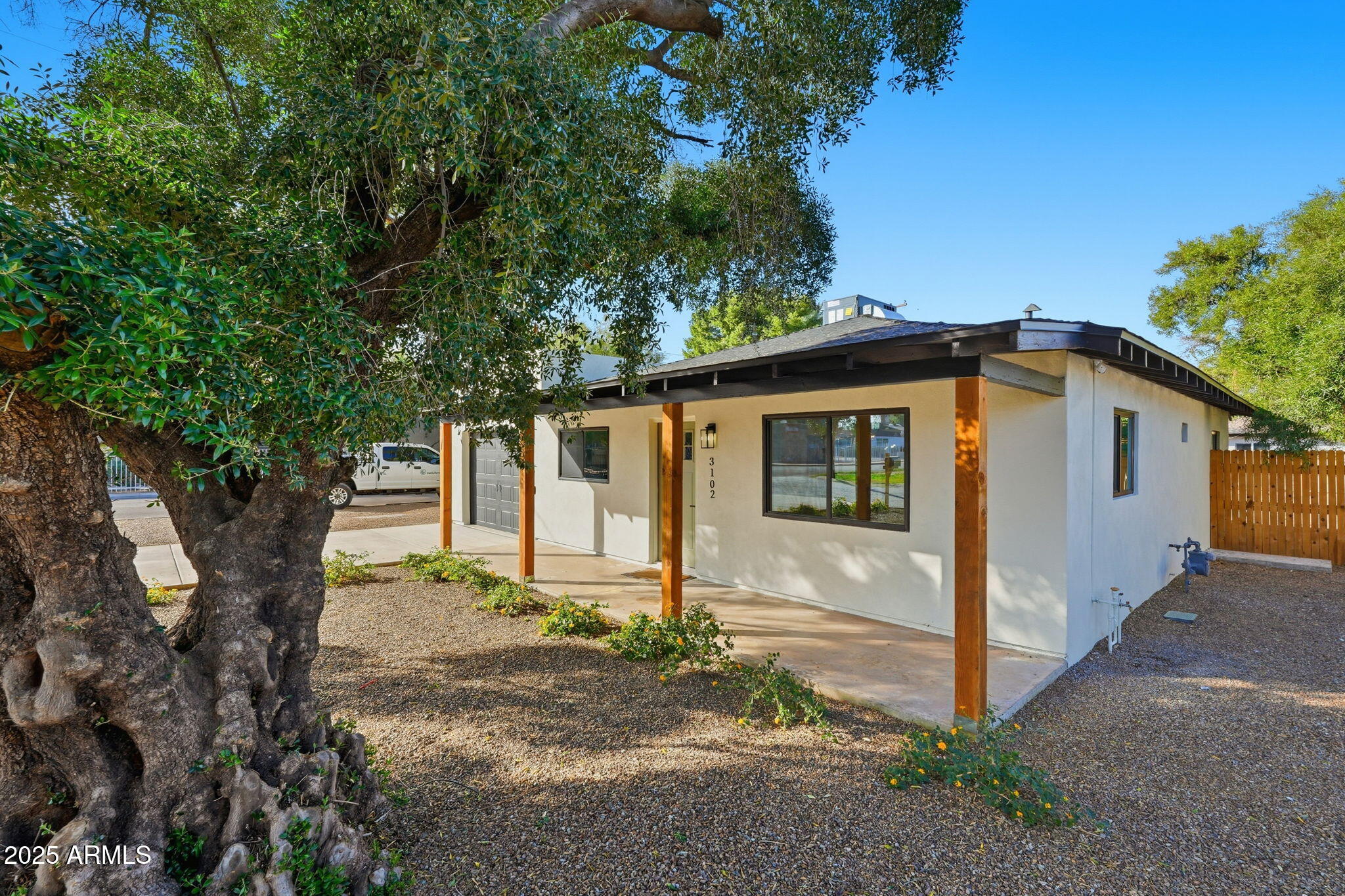 3102 North 34th Street Phoenix, AZ 85018 - Photo 2 of 20 a view of a house with a tree in the background