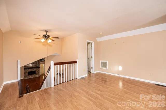 a bathroom with a granite countertop toilet sink and mirror