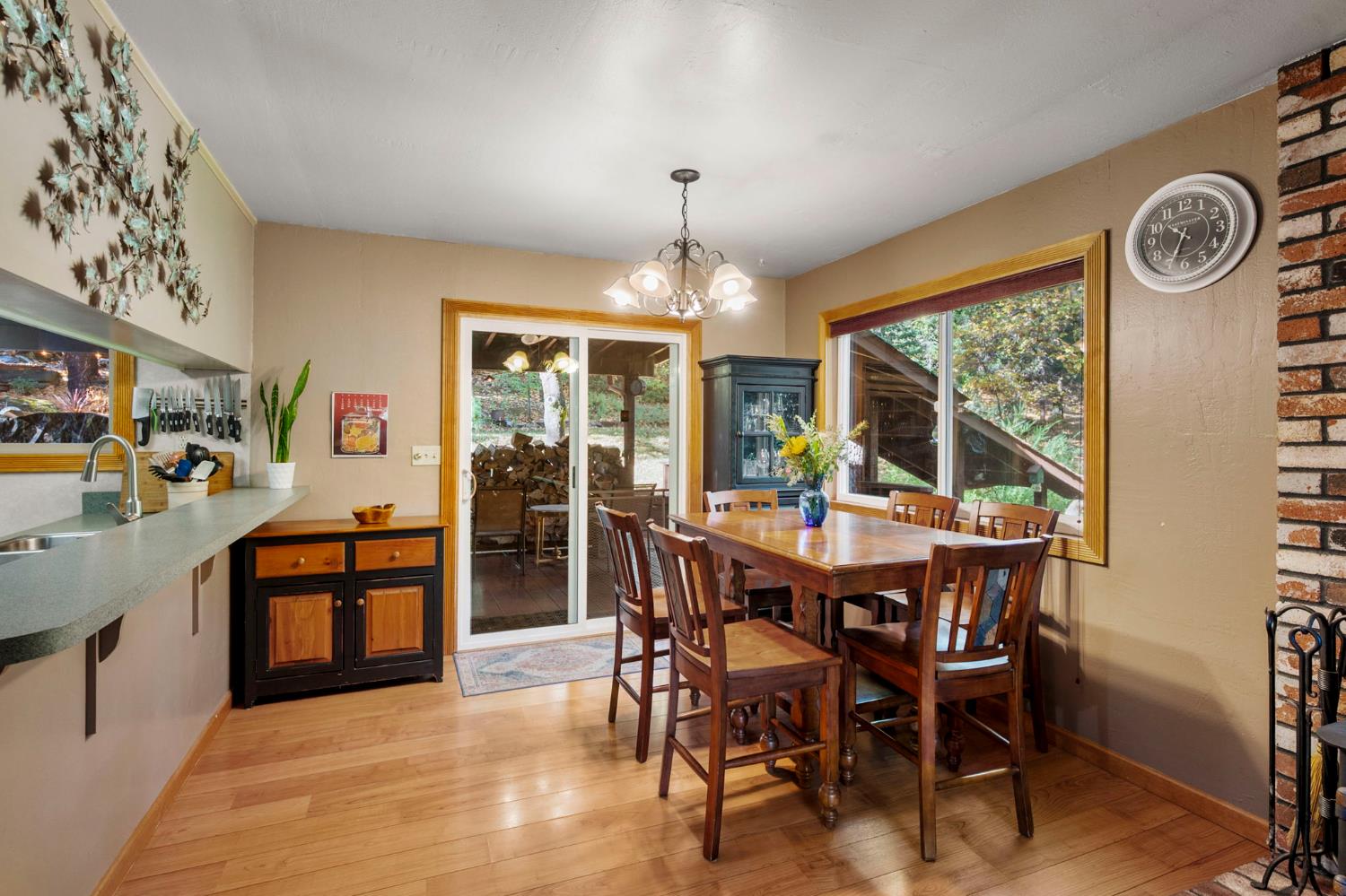 734 Utica Drive Murphys, CA 95247 - Photo 12 of 36 a view of a dining room with furniture window and wooden floor