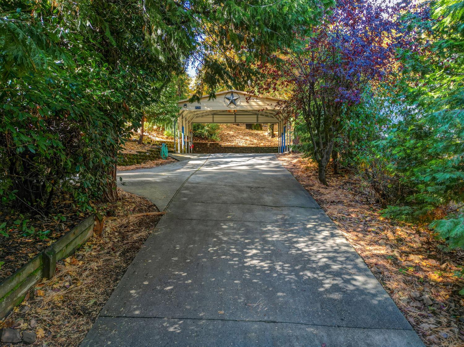 734 Utica Drive Murphys, CA 95247 - Photo 34 of 36 a front view of a house with a yard and garage
