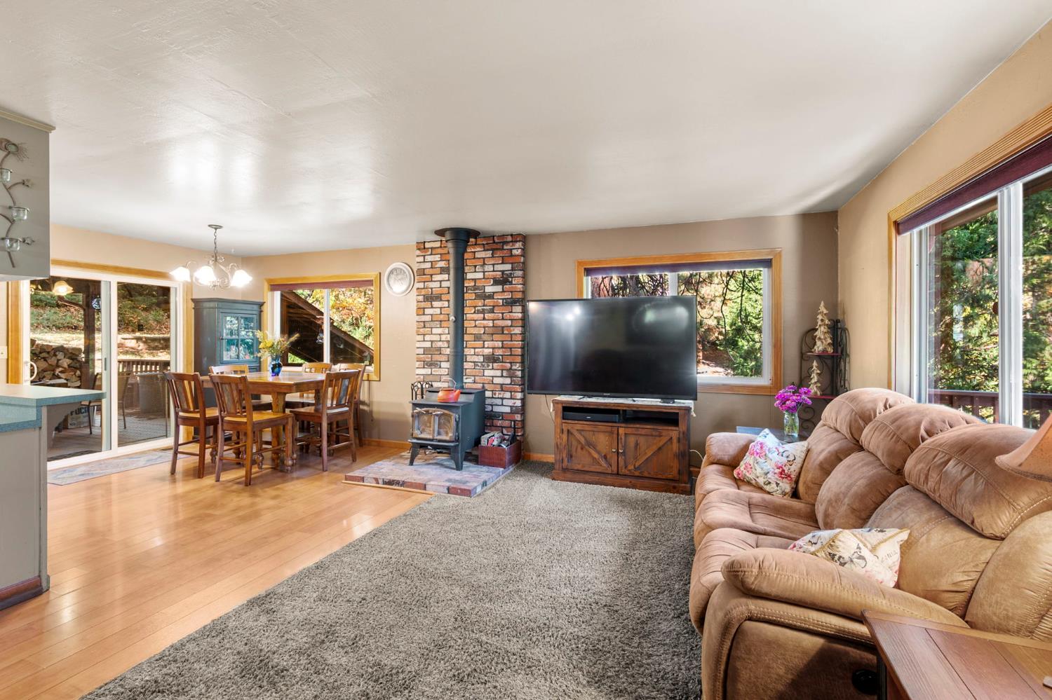 734 Utica Drive Murphys, CA 95247 - Photo 7 of 36 a living room with furniture and a flat screen tv