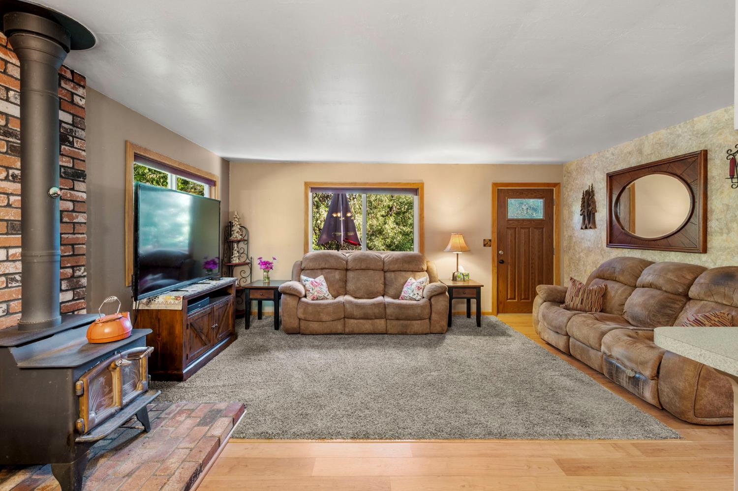 734 Utica Drive Murphys, CA 95247 - Photo 8 of 36 a living room with furniture and a flat screen tv