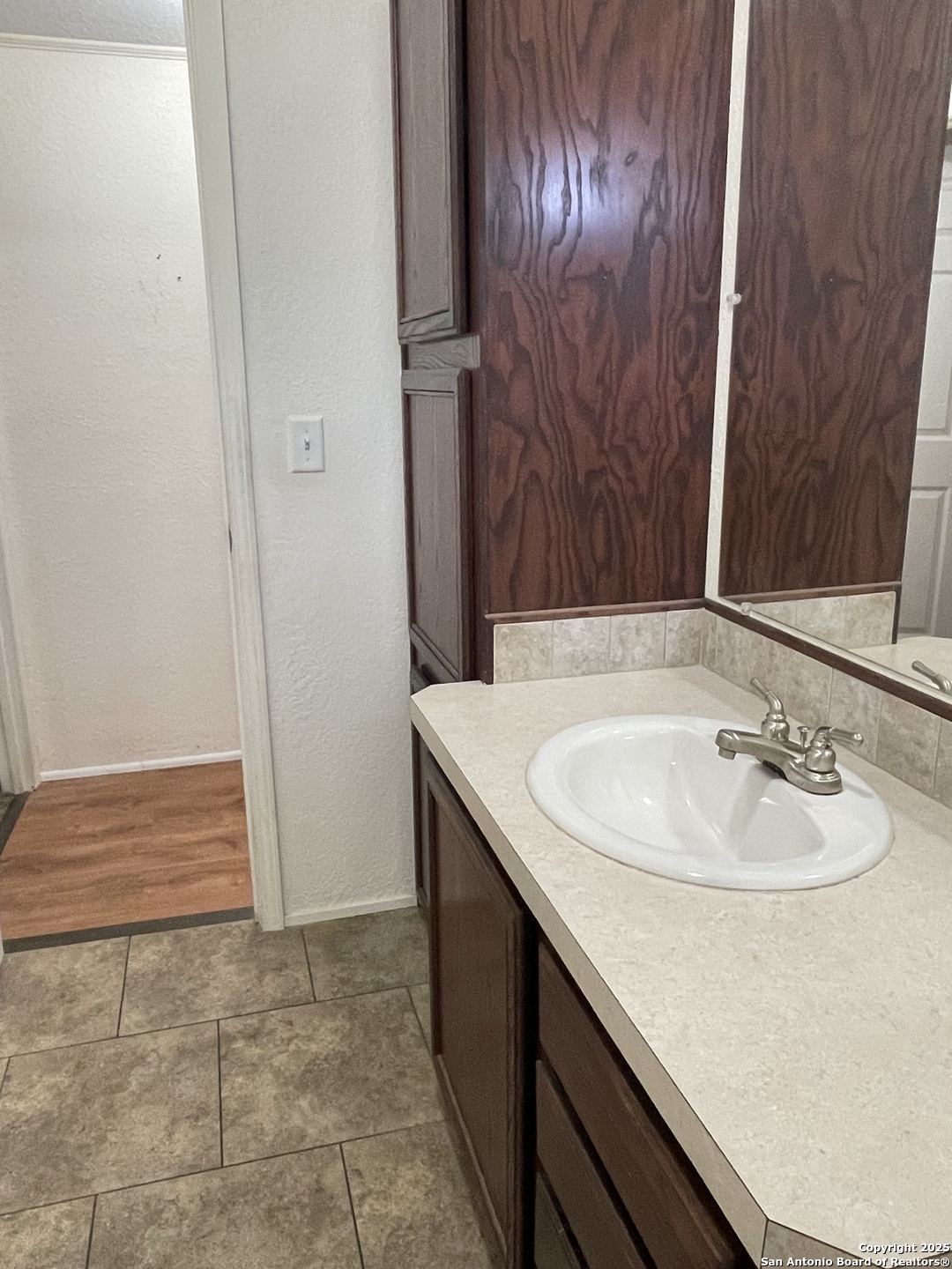 449 Mountain View Drive Bandera, TX 78003 - Photo 14 of 18 a bathroom with a sink and a mirror