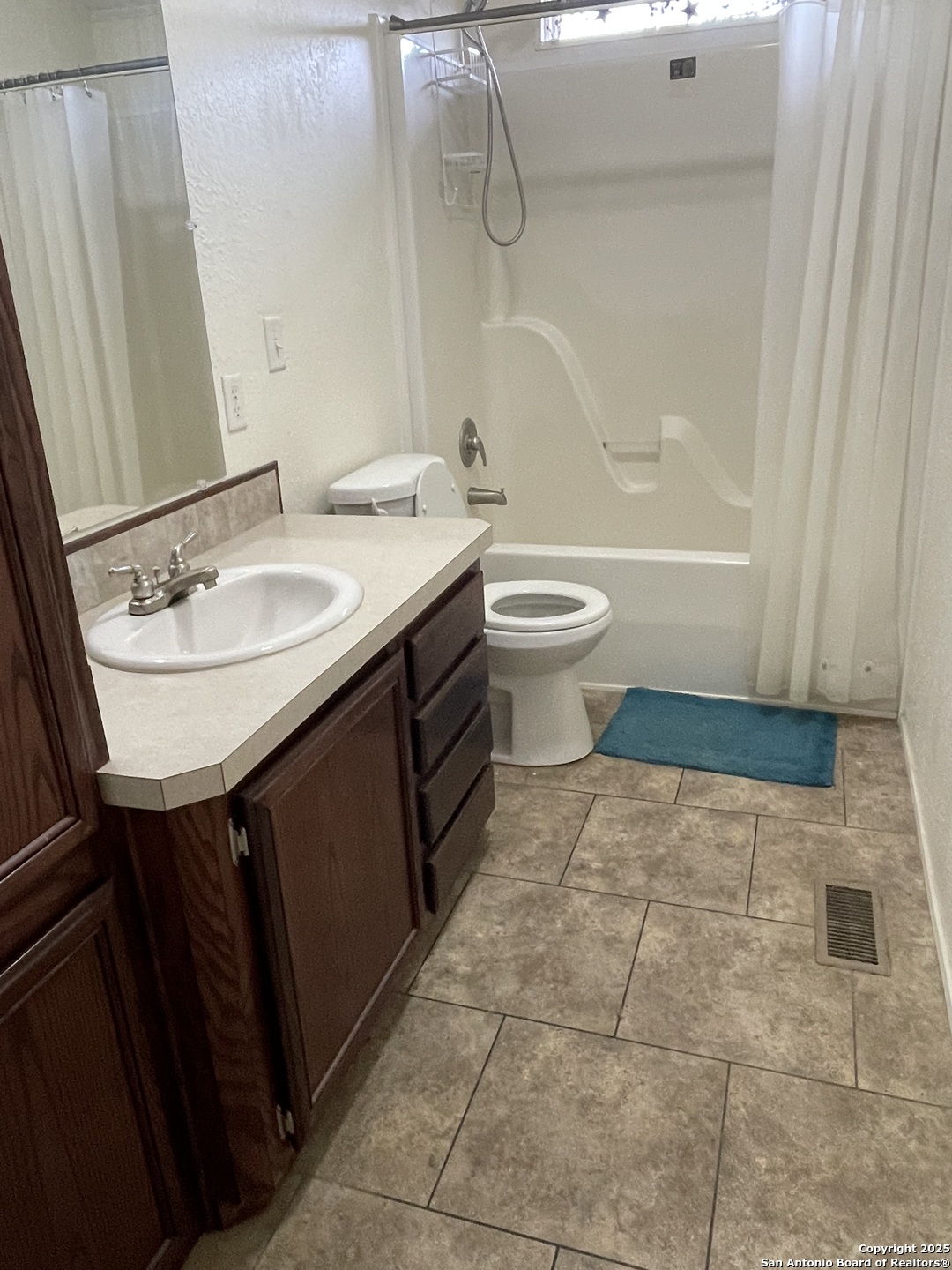 449 Mountain View Drive Bandera, TX 78003 - Photo 15 of 18 a bathroom with a sink a toilet and shower