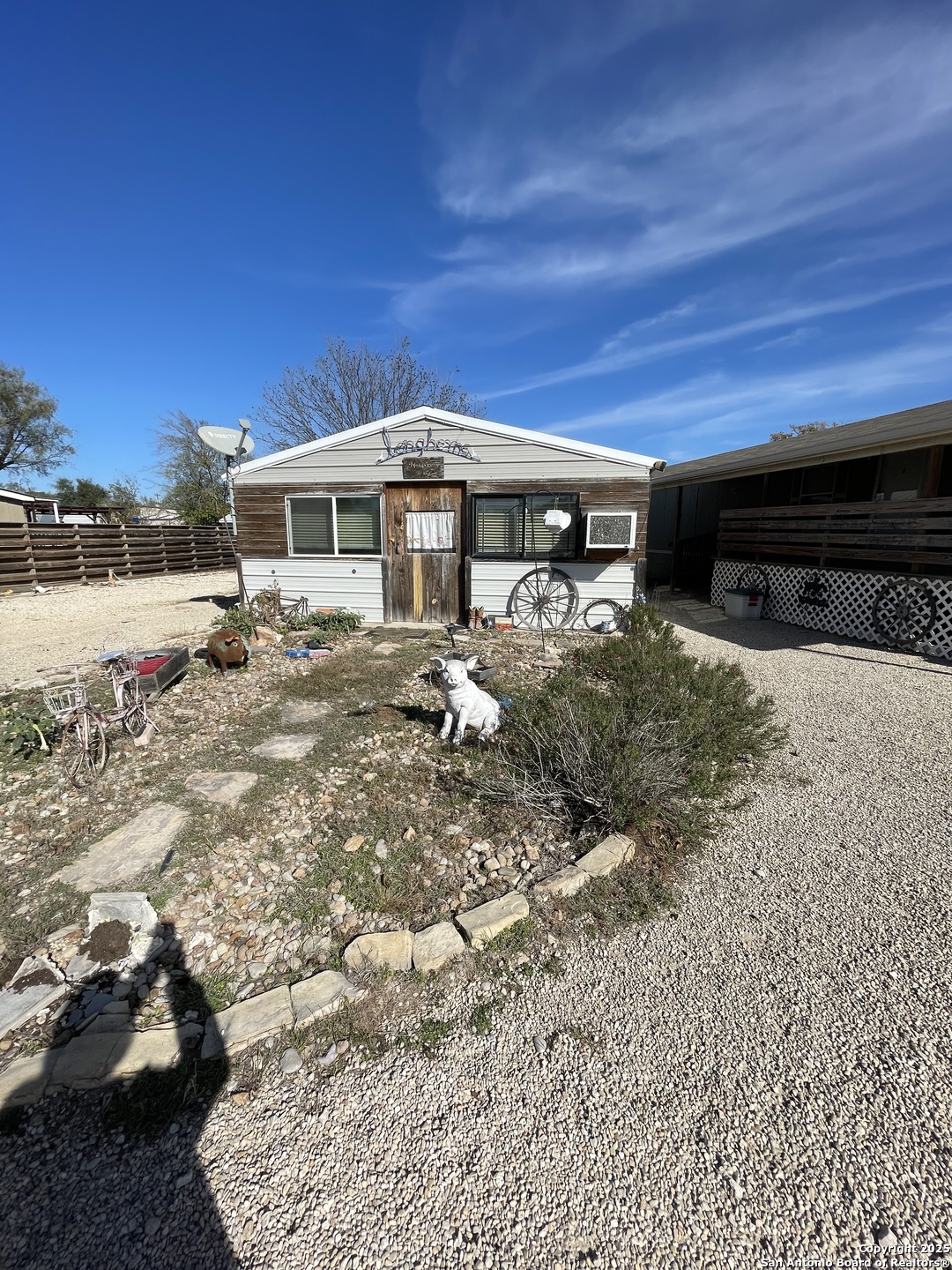 449 Mountain View Drive Bandera, TX 78003 - Photo 2 of 18 a front view of a house with a yard