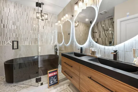 a bathroom with a shower and a sink