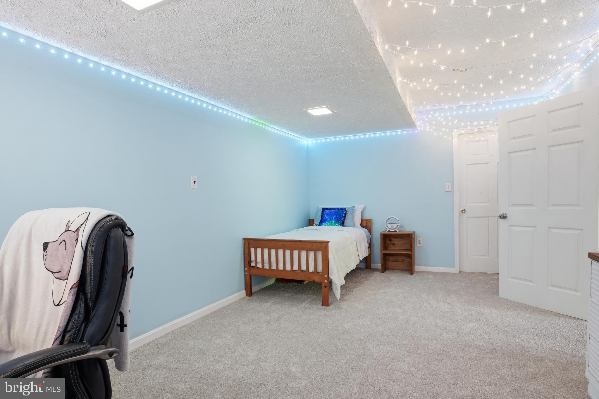 6118 Fishers Station Road Lothian, MD 20711 - Photo 37 of 62 a spacious bedroom with a bed and a window