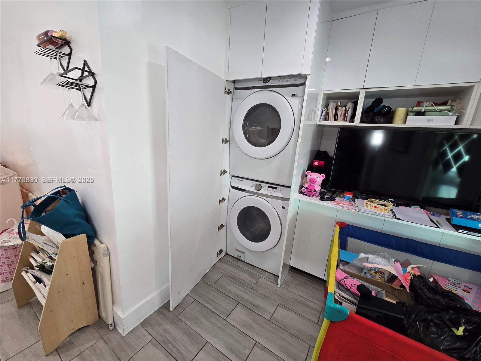 1011 Northwest 64th Street Miami, FL 33150 - Photo 16 of 48 a utility room with dryer and washer