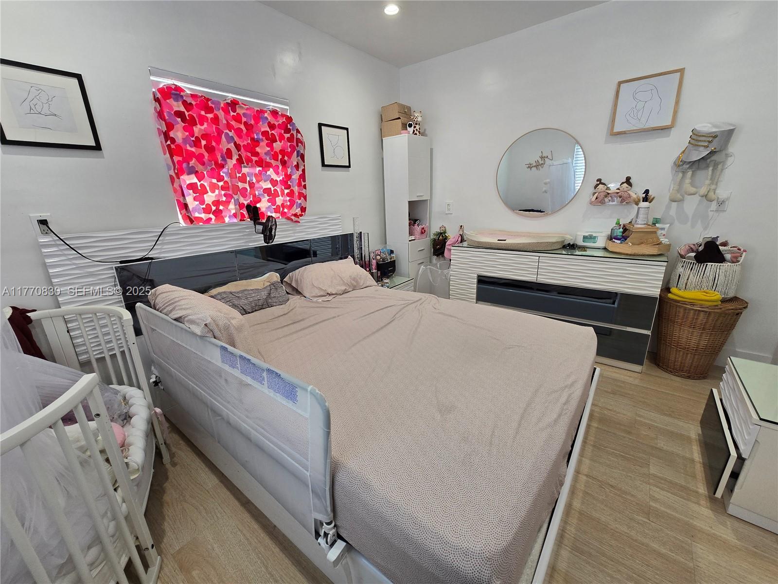 1011 Northwest 64th Street Miami, FL 33150 - Photo 28 of 48 a bedroom with furniture and a bed