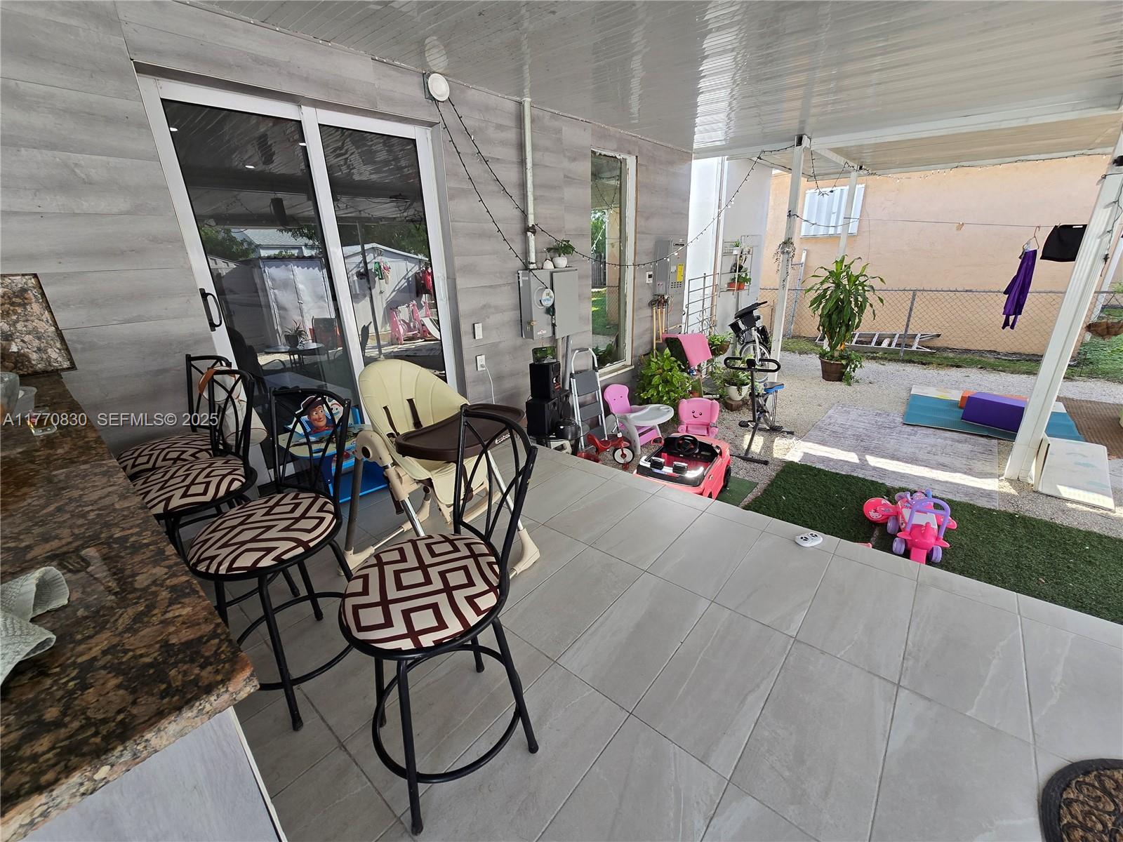 1011 Northwest 64th Street Miami, FL 33150 - Photo 35 of 48 a view of swimming pool with outdoor seating