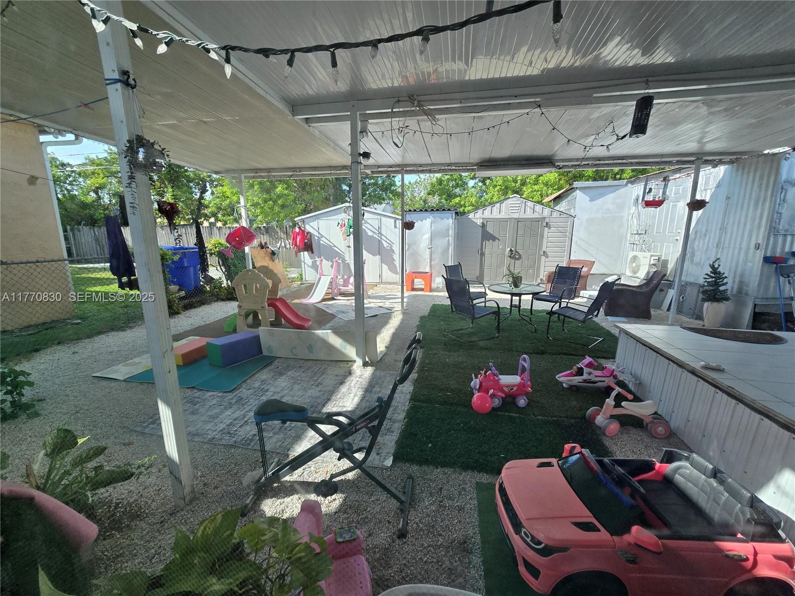 1011 Northwest 64th Street Miami, FL 33150 - Photo 40 of 48 an outdoor space with seating