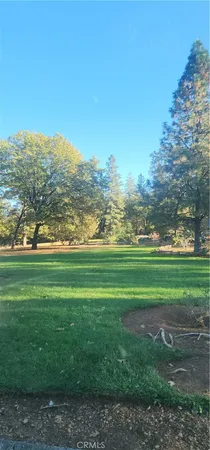 a view of field with mountains in the background
