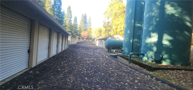 a view of a pathway with a yard of the house