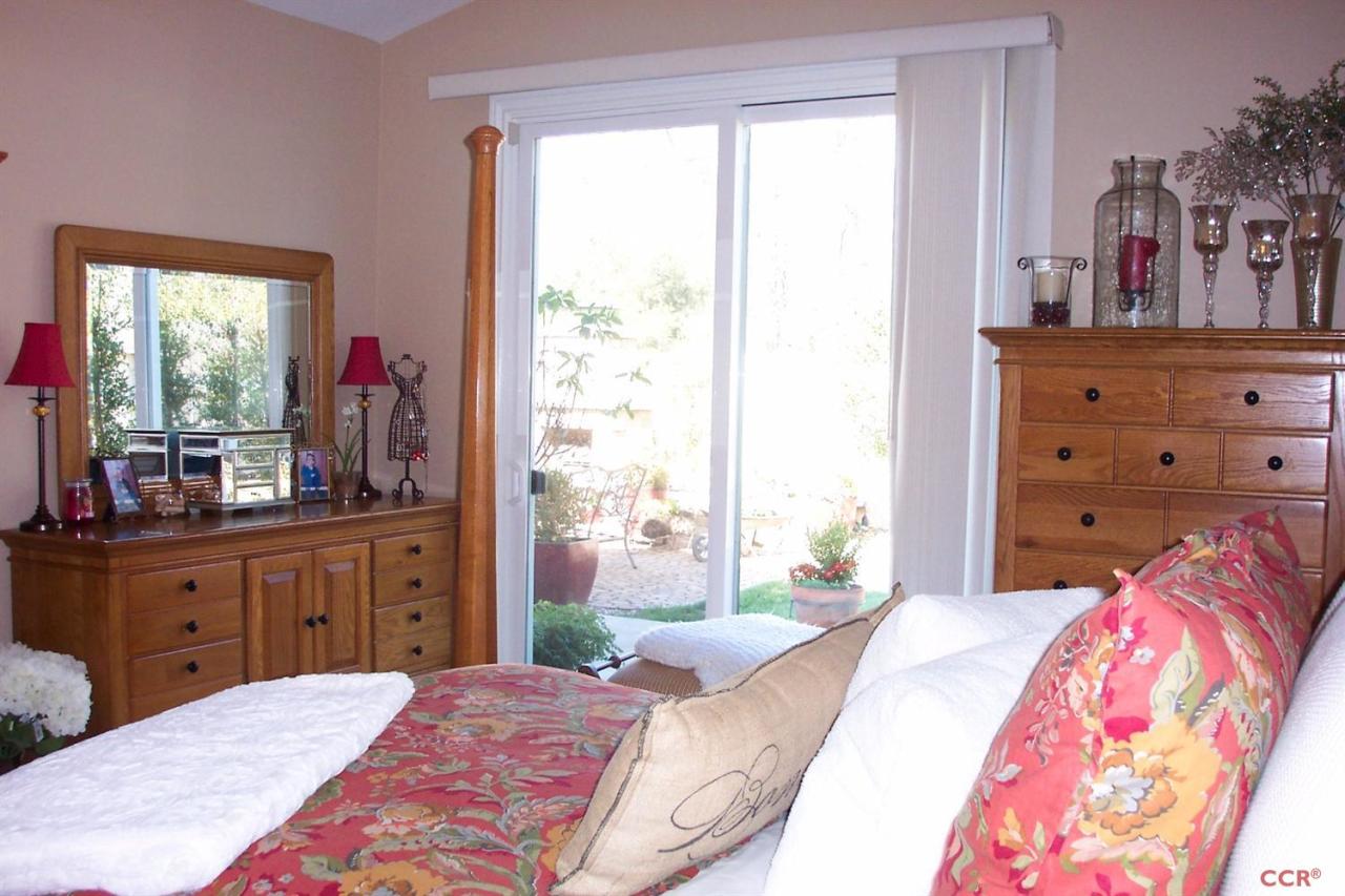 737 Onstott Road Lompoc, CA 93436 - Photo 11 of 22 a bedroom with a bed dresser and a window