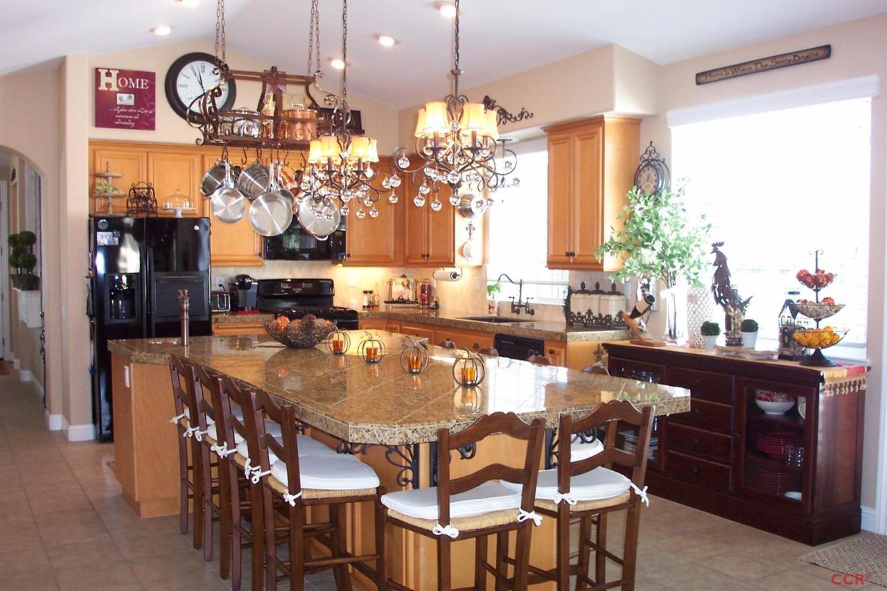 737 Onstott Road Lompoc, CA 93436 - Photo 13 of 22 a dining table chairs and chandelier