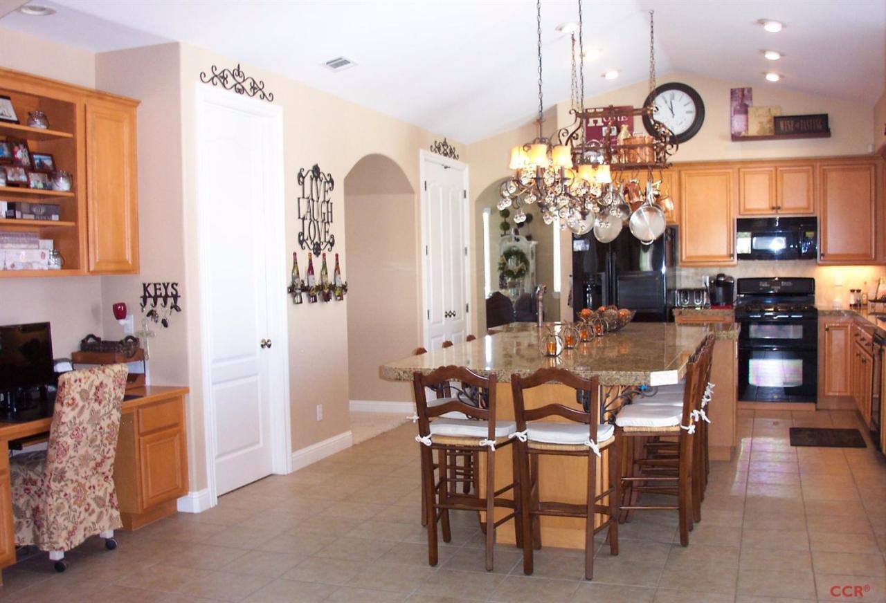 737 Onstott Road Lompoc, CA 93436 - Photo 16 of 22 a view of a dining room with furniture and chandelier