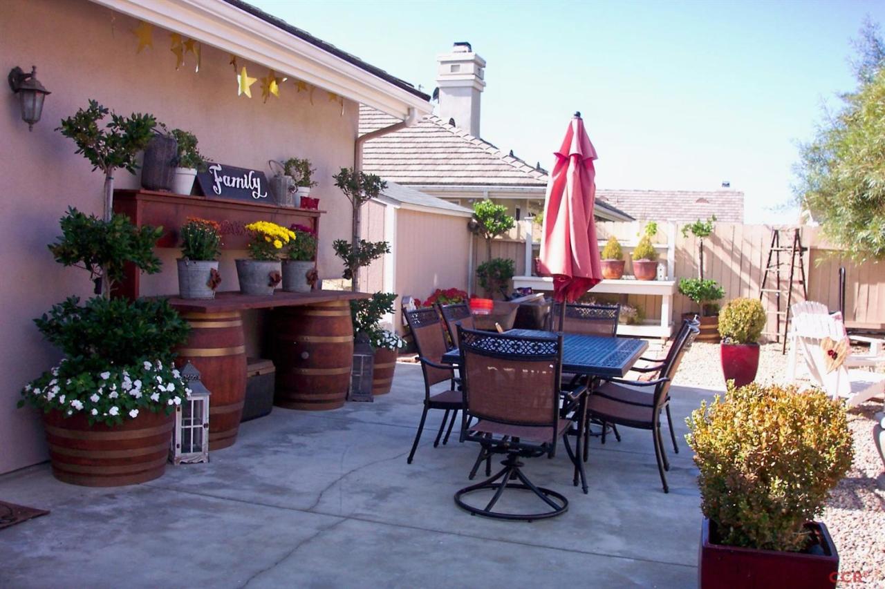 737 Onstott Road Lompoc, CA 93436 - Photo 21 of 22 a view of a dining room with furniture and a potted plant