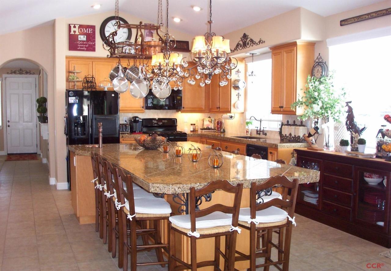 737 Onstott Road Lompoc, CA 93436 - Photo 5 of 22 a view of a dining room with furniture and chandelier
