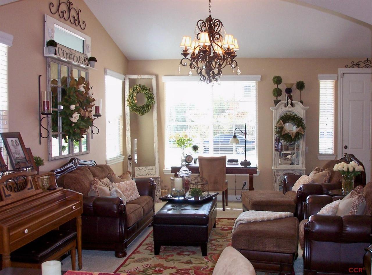 737 Onstott Road Lompoc, CA 93436 - Photo 8 of 22 a living room with furniture chandelier and a large window