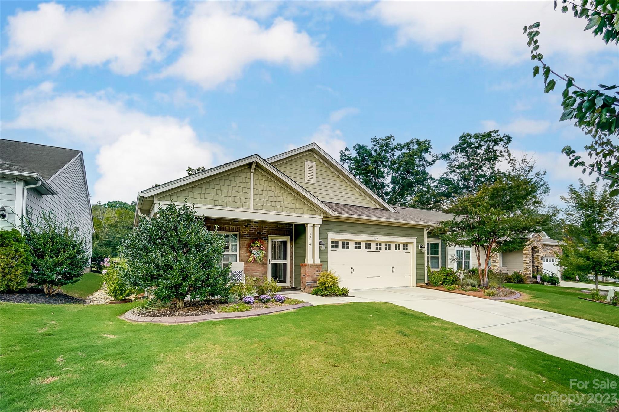 front view of a house with a yard