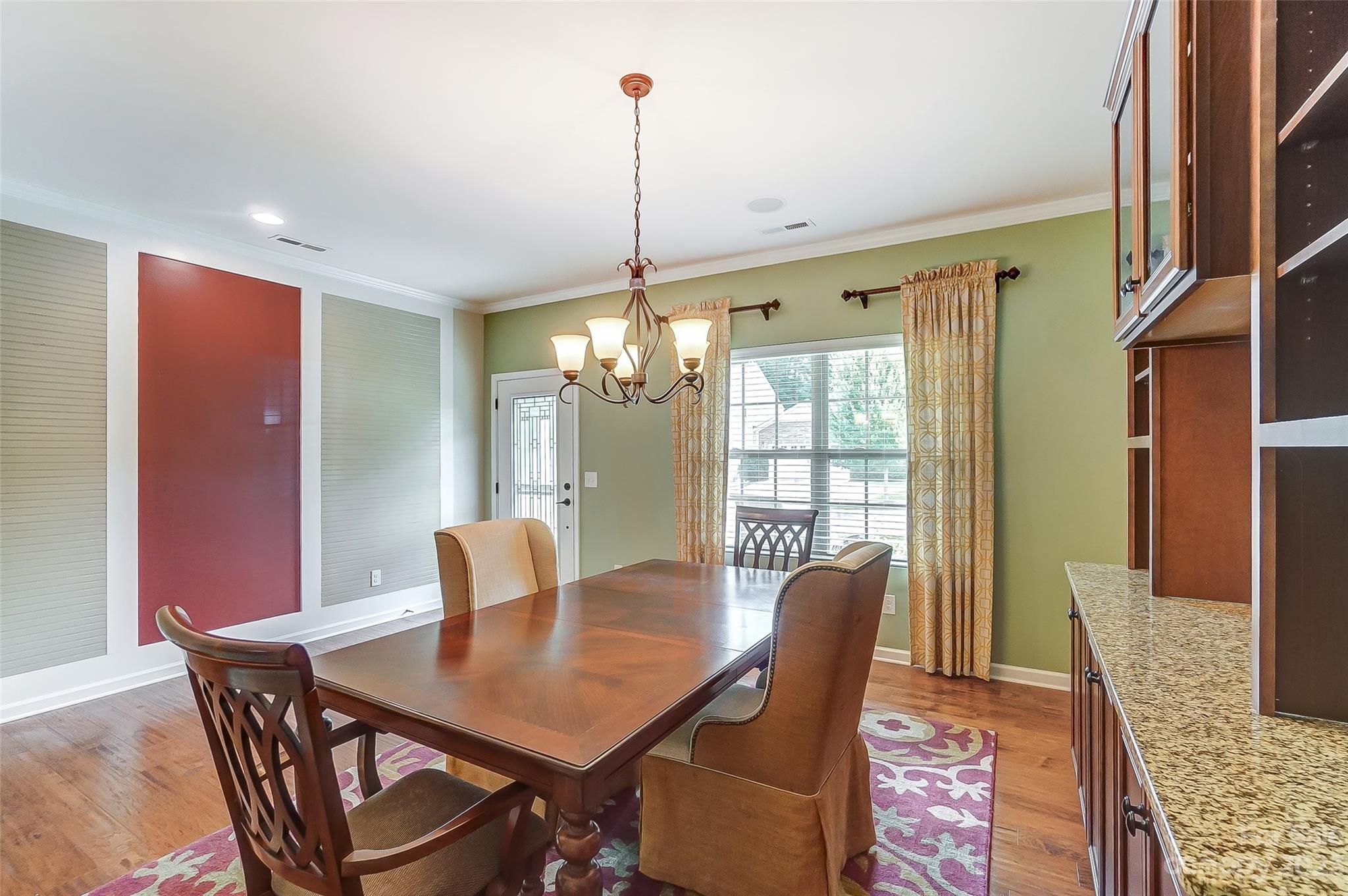 1719 Still River Way Fort Mill, SC 29708 - Photo 12 of 41 a view of a dining room with furniture window and wooden floor