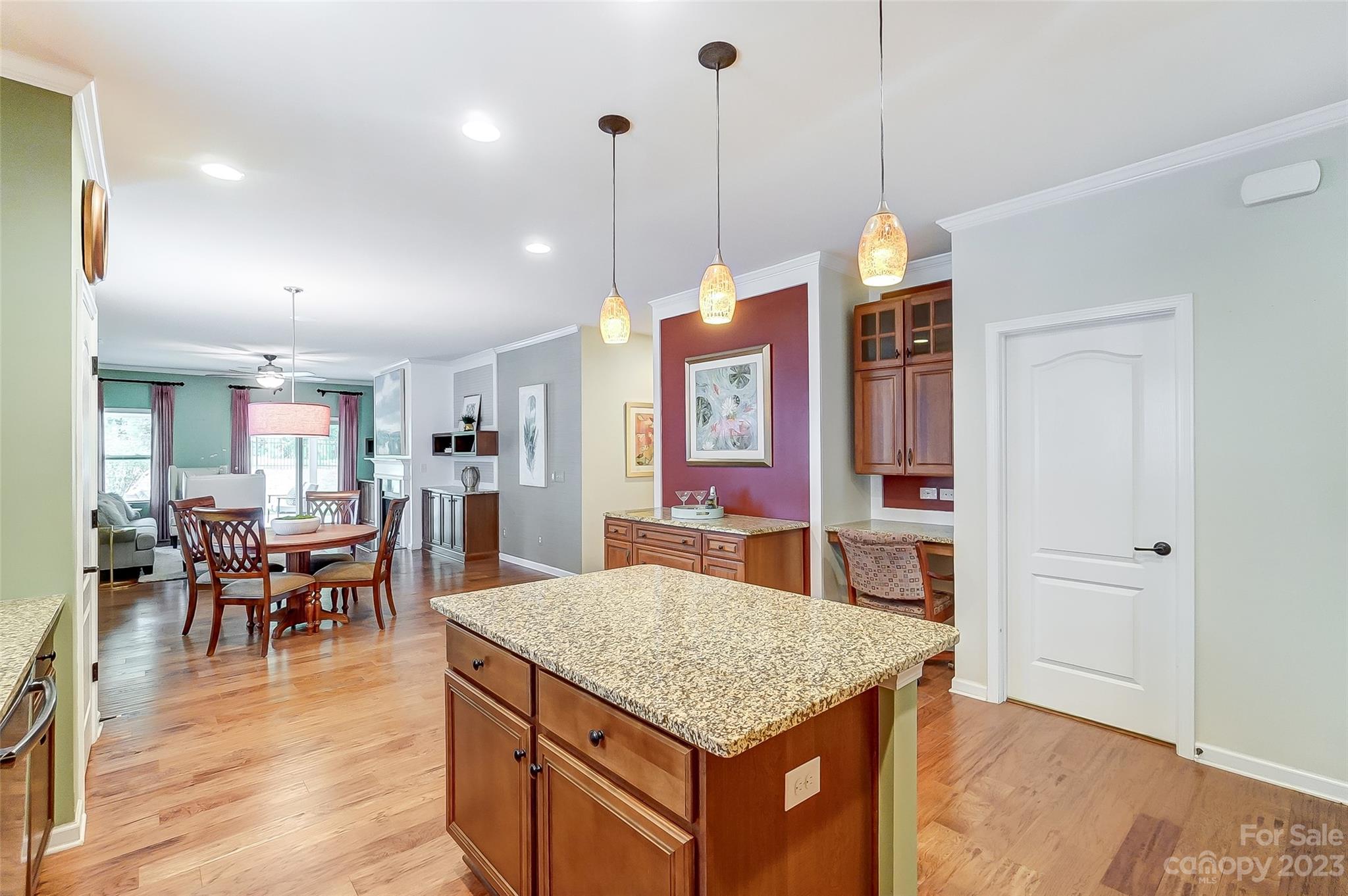 1719 Still River Way Fort Mill, SC 29708 - Photo 13 of 41 a kitchen with stainless steel appliances granite countertop a kitchen island a stove and a wooden cabinets