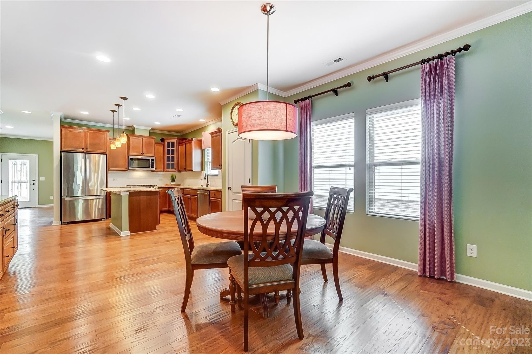 1719 Still River Way Fort Mill, SC 29708 - Photo 15 of 41 a view of a dining room with furniture window and wooden floor