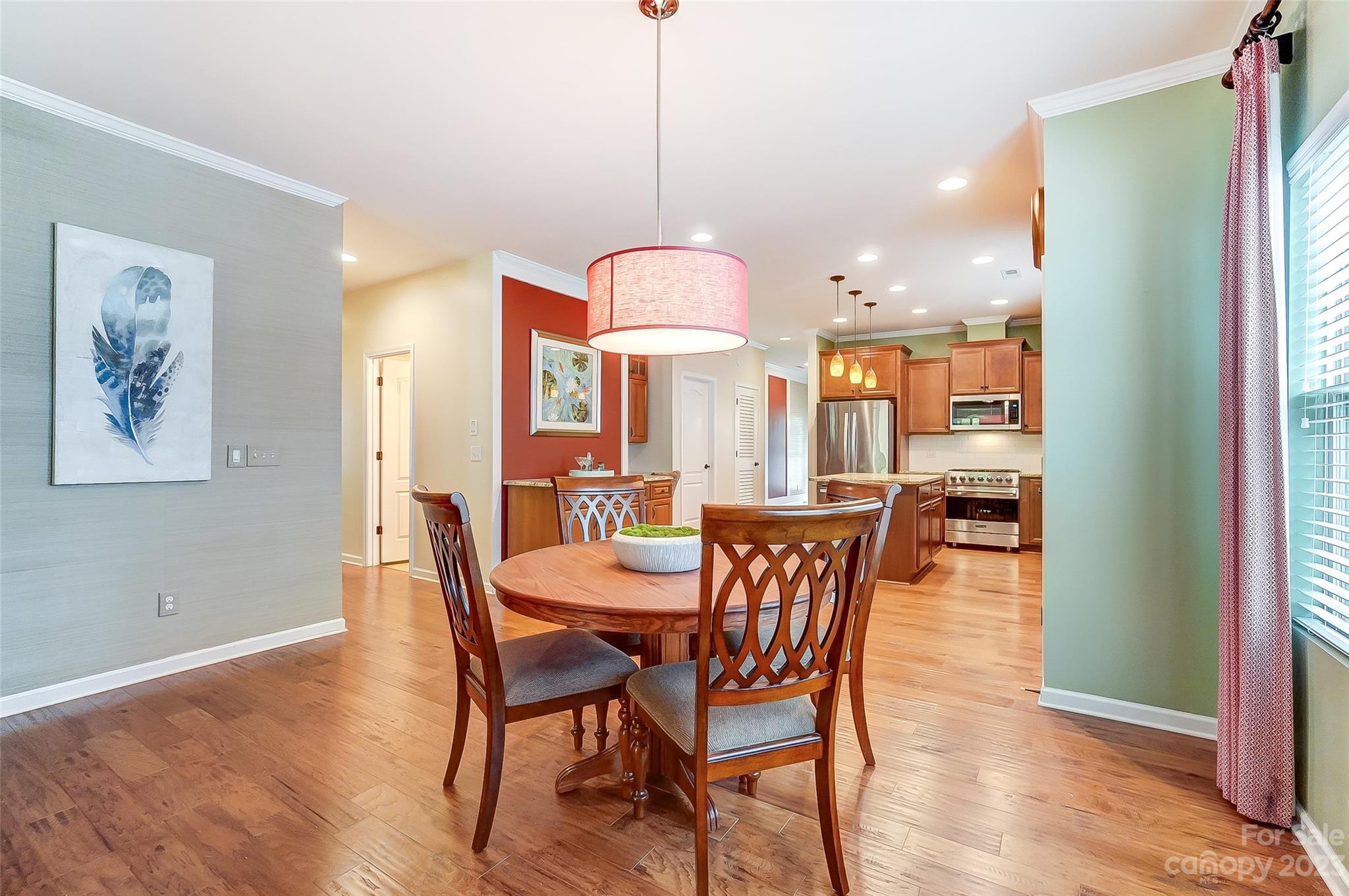 1719 Still River Way Fort Mill, SC 29708 - Photo 16 of 41 a view of a dining room with furniture window and wooden floor