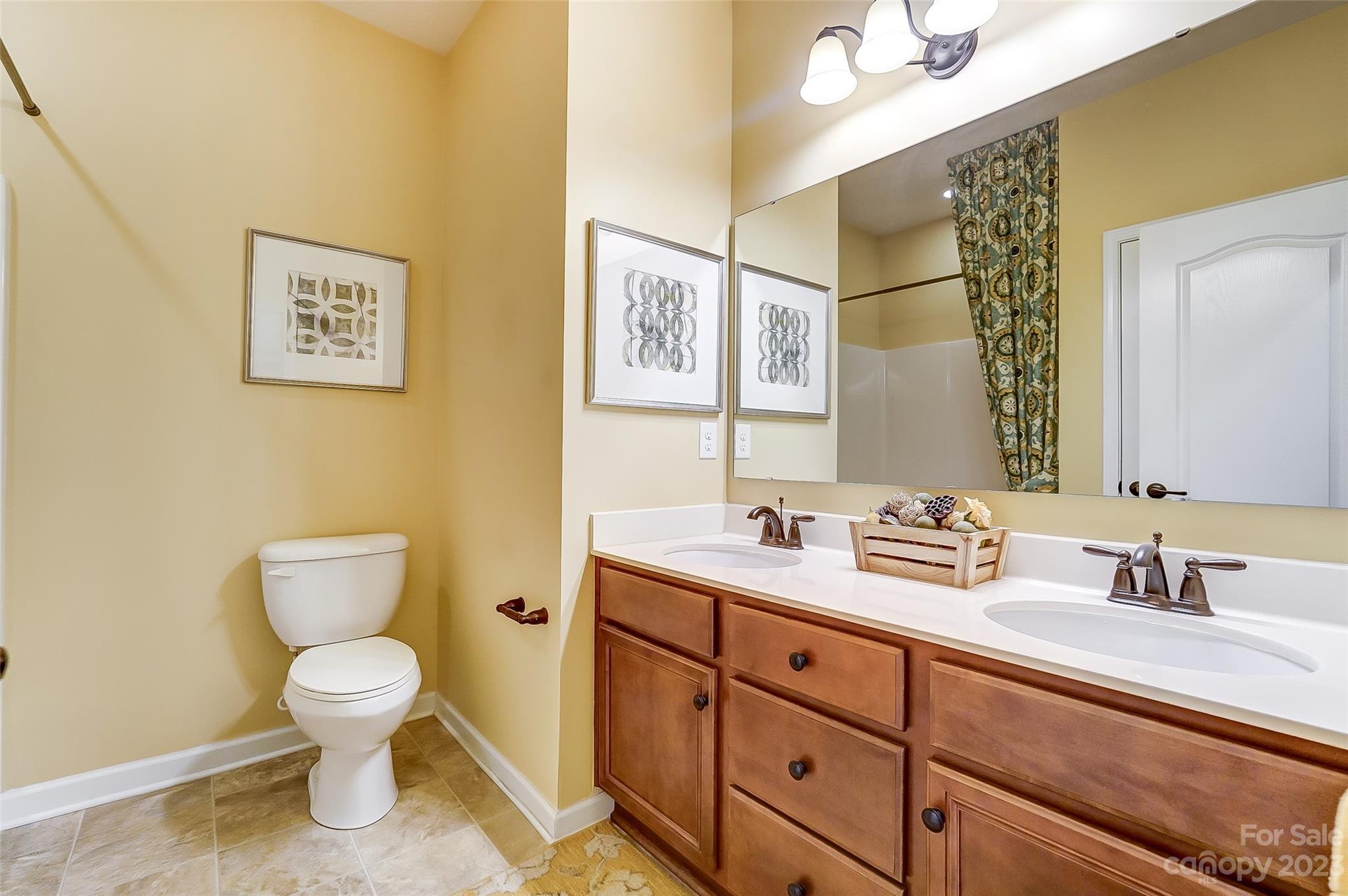 1719 Still River Way Fort Mill, SC 29708 - Photo 17 of 41 a bathroom with a toilet sink and mirror