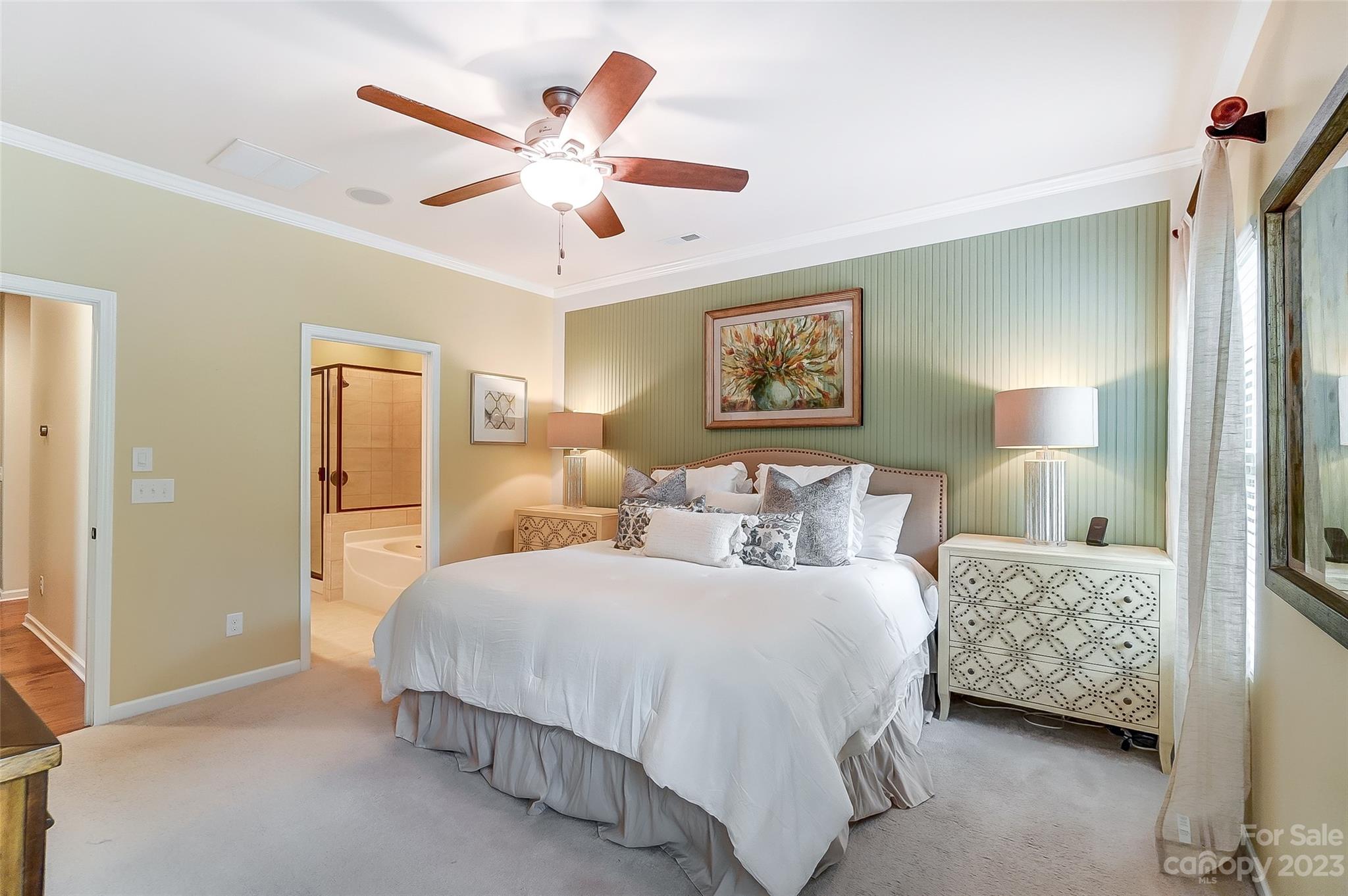 1719 Still River Way Fort Mill, SC 29708 - Photo 19 of 41 a bedroom with a bed and a chandelier