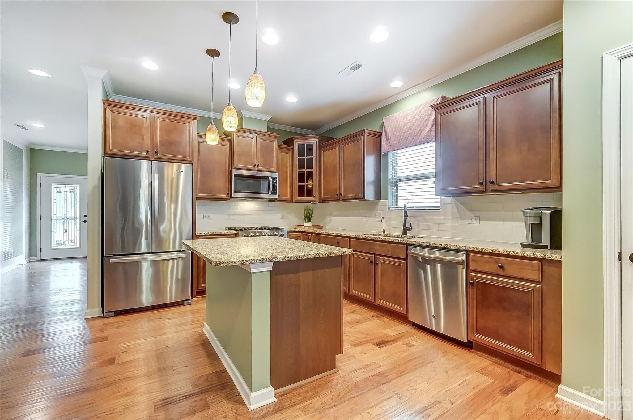 1719 Still River Way Fort Mill, SC 29708 - Photo 4 of 41 a kitchen with stainless steel appliances granite countertop a refrigerator a sink and a stove