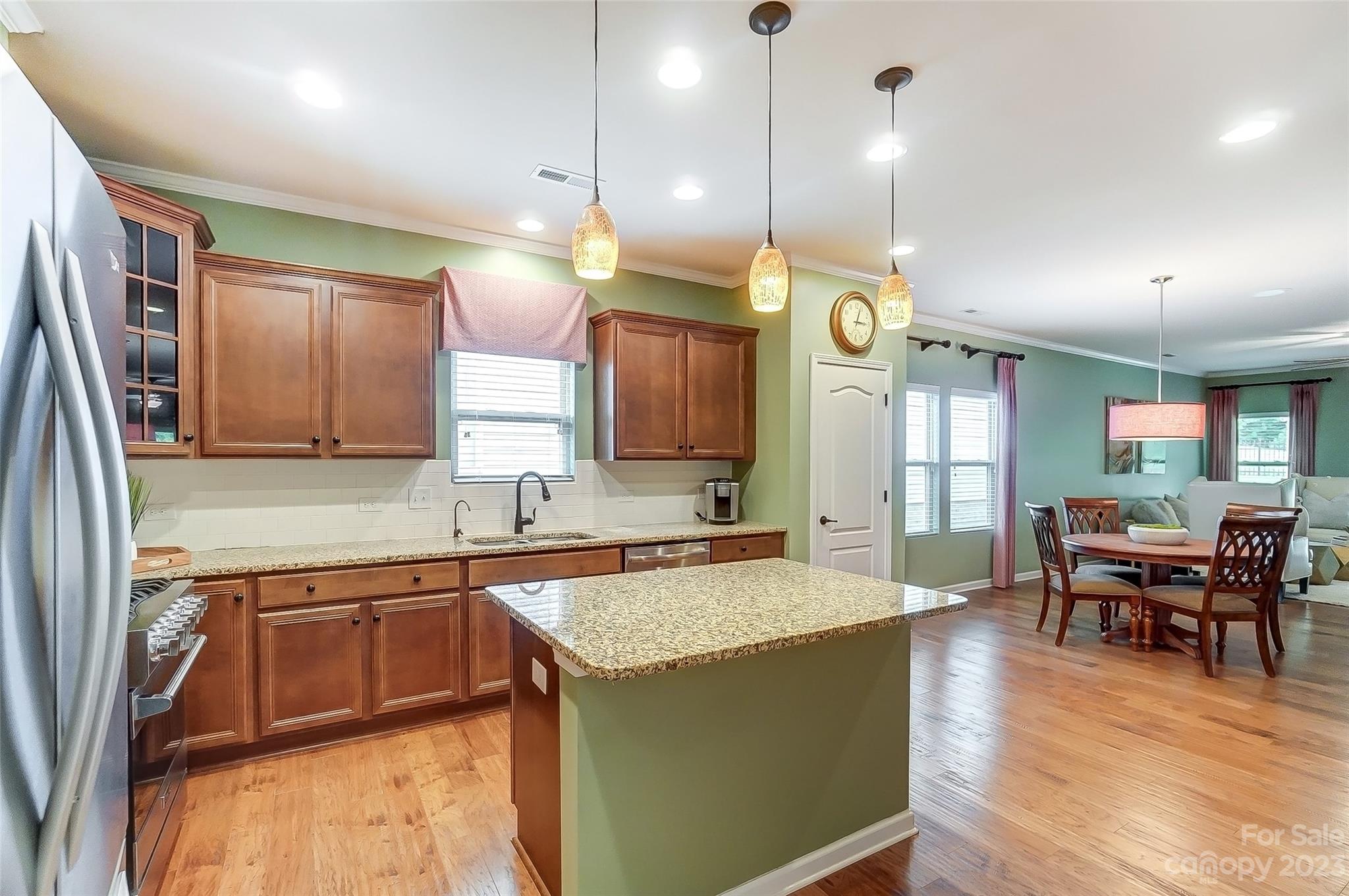 1719 Still River Way Fort Mill, SC 29708 - Photo 6 of 41 a large kitchen with a table and chairs in it